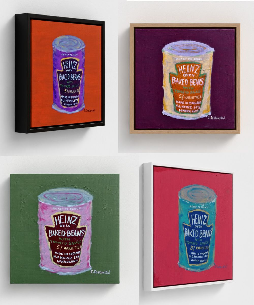 Four framed rich coloured paintings of Heinz baked beans cans on a white wall.