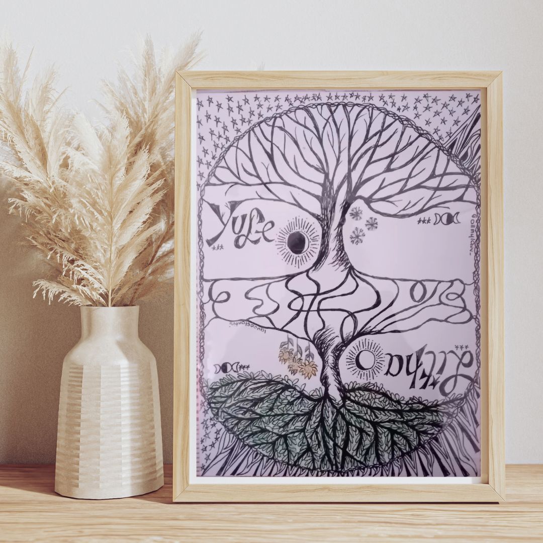 Framed artwork with yggdrasil tree design and Yule and Litha solstices text on a wooden surface with a vase of pampas grass.